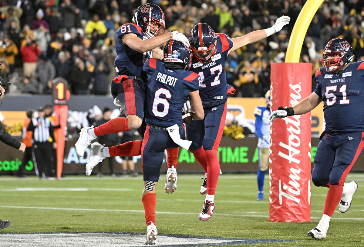 Nov 19, 2023; Hamilton, Ontario, CAN; Montreal Alouettes wide receiver Tyson Philpot (6) celebrates with wide receivers Mack Austin (81) and Cole Spieker (17) after scoring the winning touchdown against the Winnipeg Blue Bombers with 13 seconds left in the second half at Tim Hortons Field. Mandatory Credit: Dan Hamilton-USA TODAY Sports
